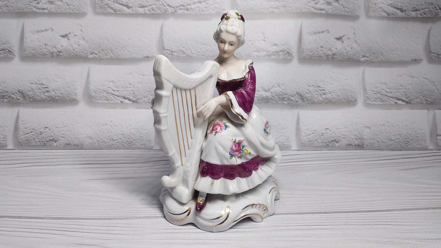 Porcelain vintage romanian figurine girl with alpha.