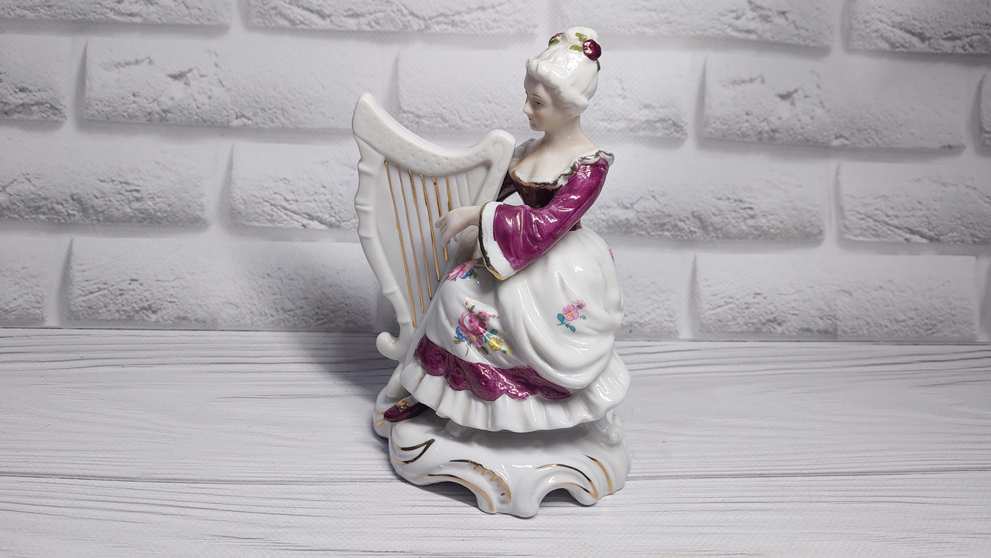 Porcelain vintage romanian figurine girl with alpha.