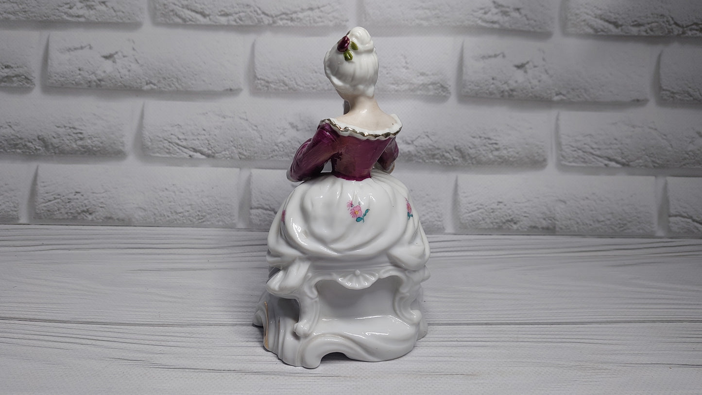 Porcelain vintage romanian figurine girl with alpha.