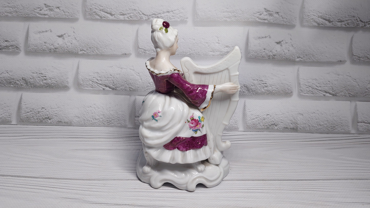 Porcelain vintage romanian figurine girl with alpha.