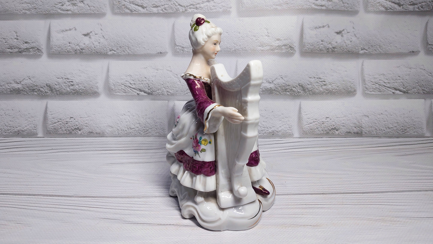 Porcelain vintage romanian figurine girl with alpha.