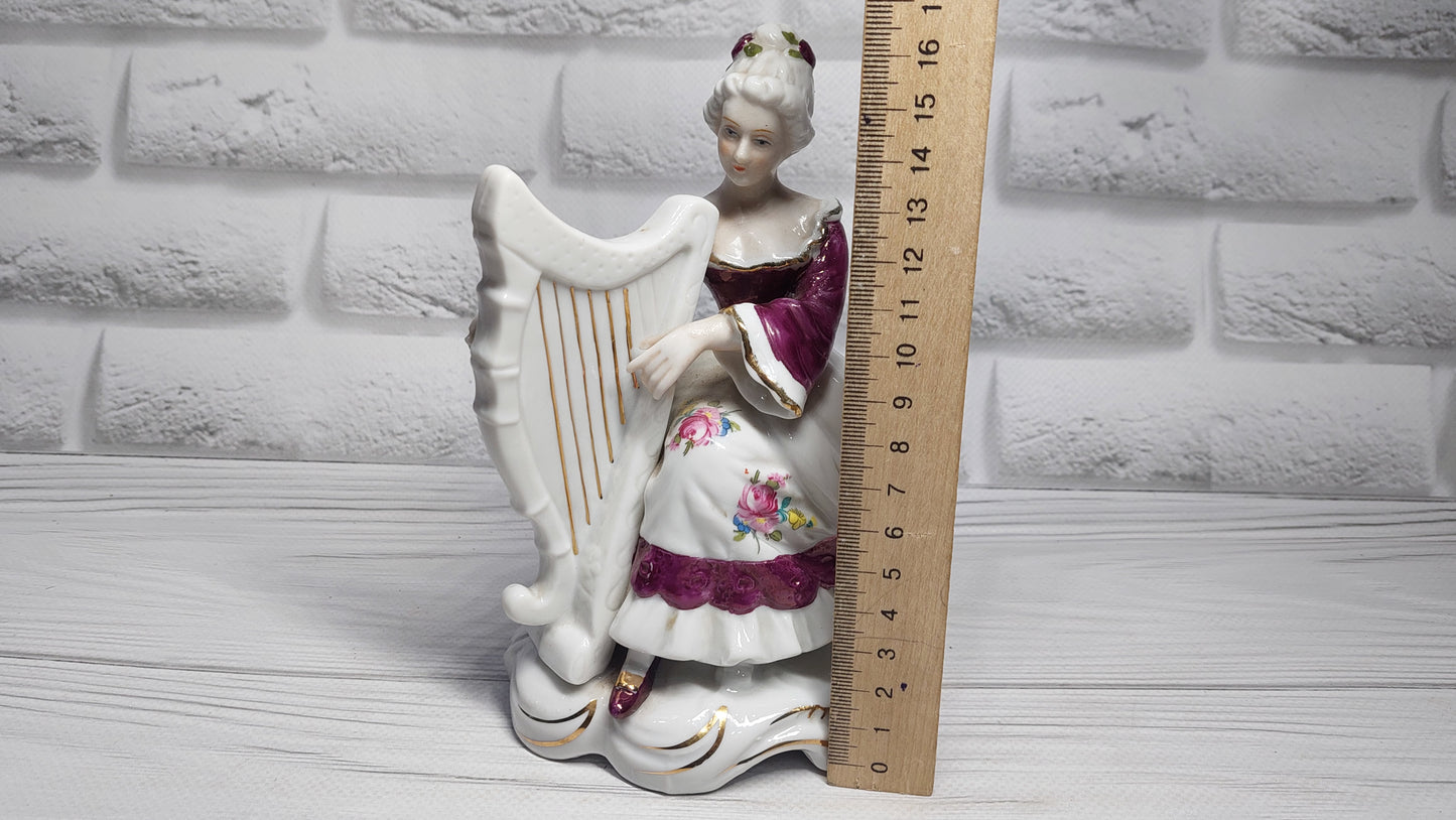 Porcelain vintage romanian figurine girl with alpha.