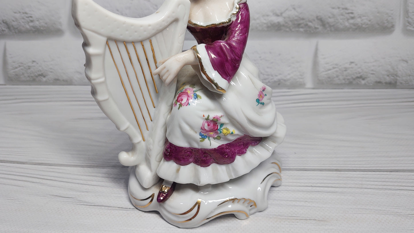 Porcelain vintage romanian figurine girl with alpha.