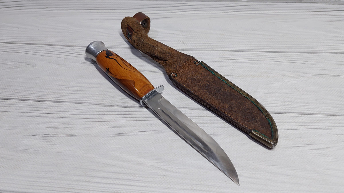 Vintage knife with a compass in the handle. Knife for a boy made in the GDR.