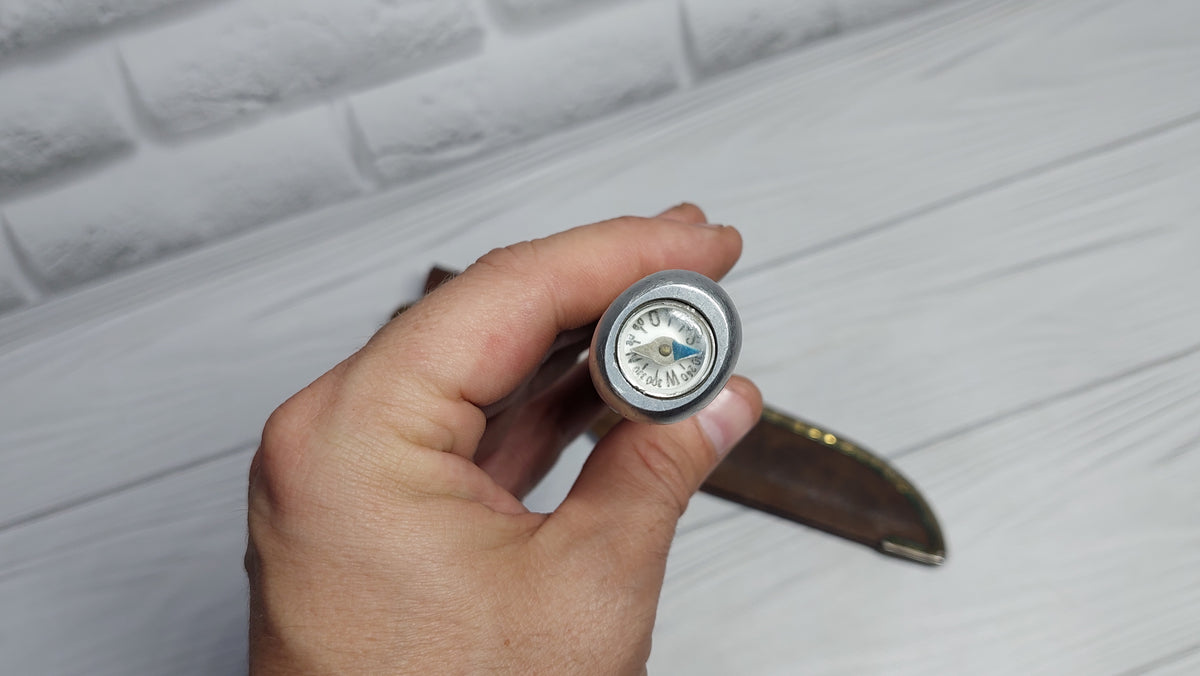 Vintage knife with a compass in the handle. Knife for a boy made in the GDR.