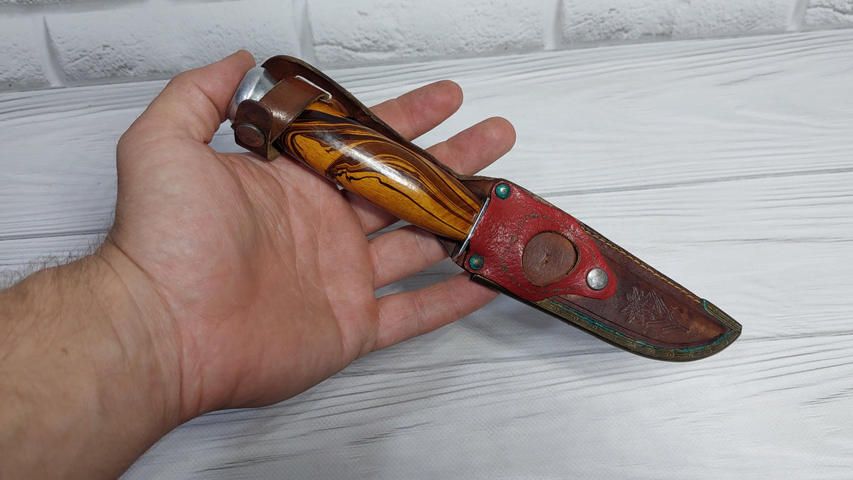 Vintage knife with a compass in the handle. Knife for a boy made in the GDR.