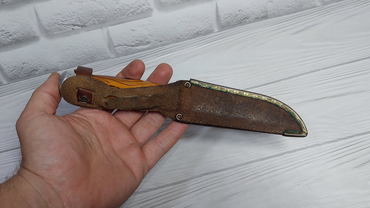 Vintage knife with a compass in the handle. Knife for a boy made in the GDR.