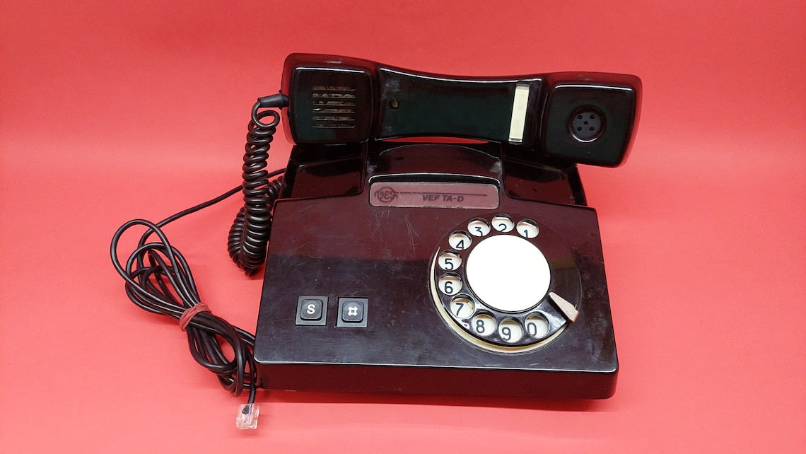 Antique telephone VEF TA_D with a rotary dial, a working Russian desk phone from the times of the USSR