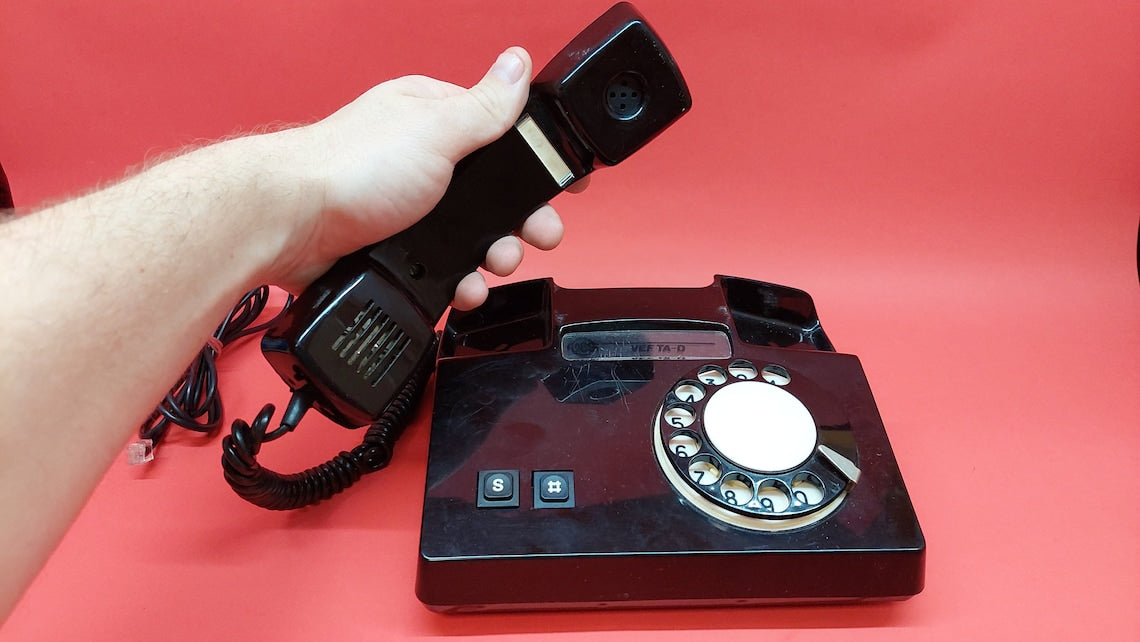 Antique telephone VEF TA_D with a rotary dial, a working Russian desk phone from the times of the USSR