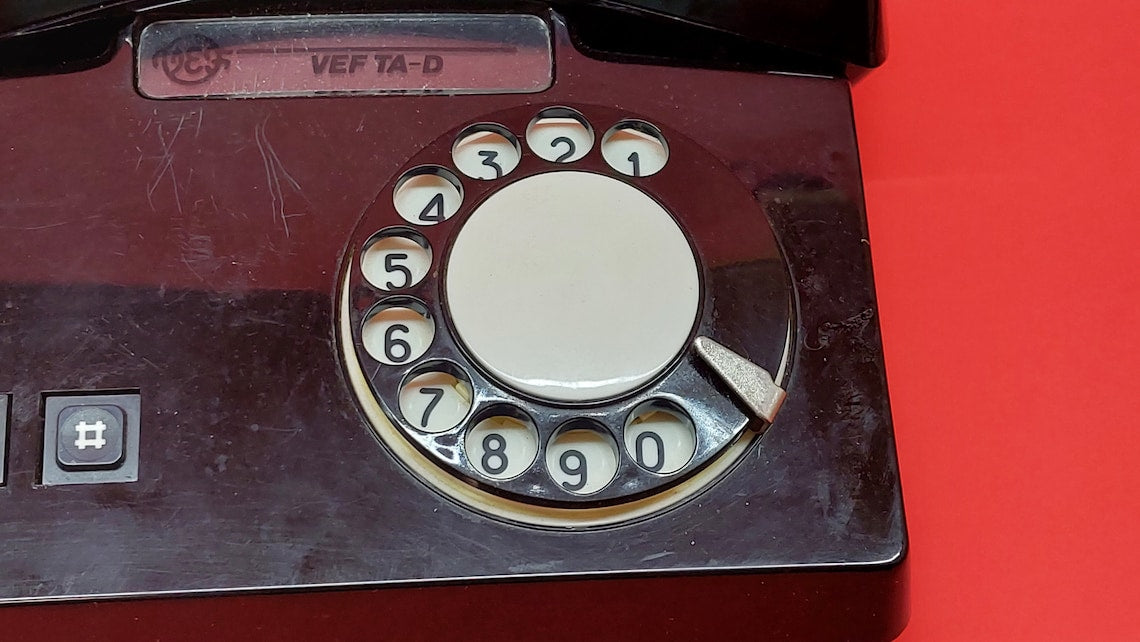 Antique telephone VEF TA_D with a rotary dial, a working Russian desk phone from the times of the USSR