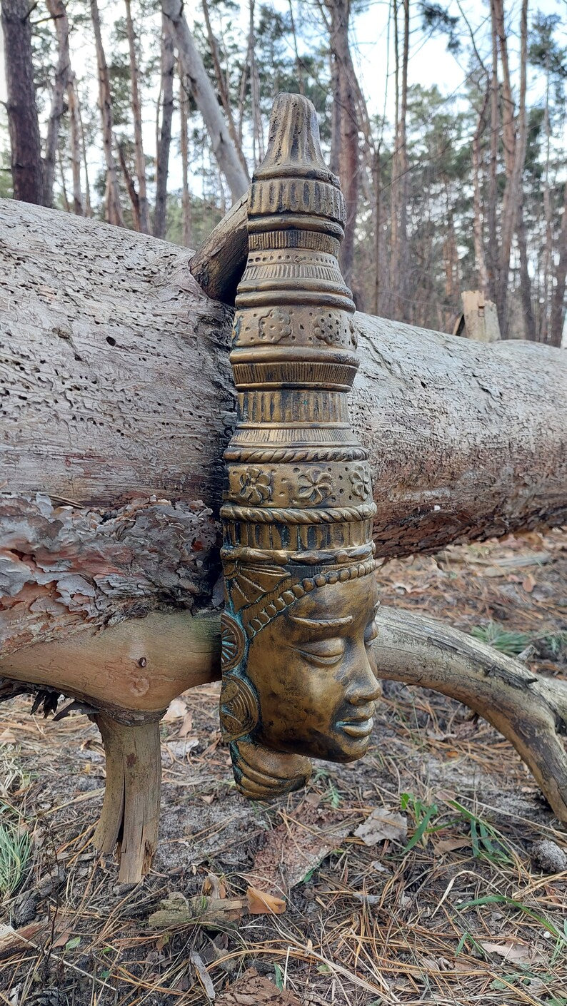 Buddha mask. Bronze buddha mask