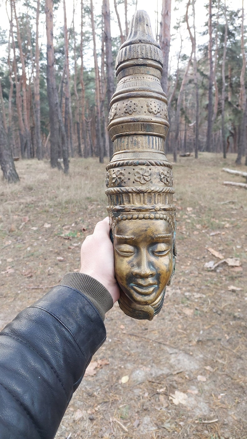Buddha mask. Bronze buddha mask