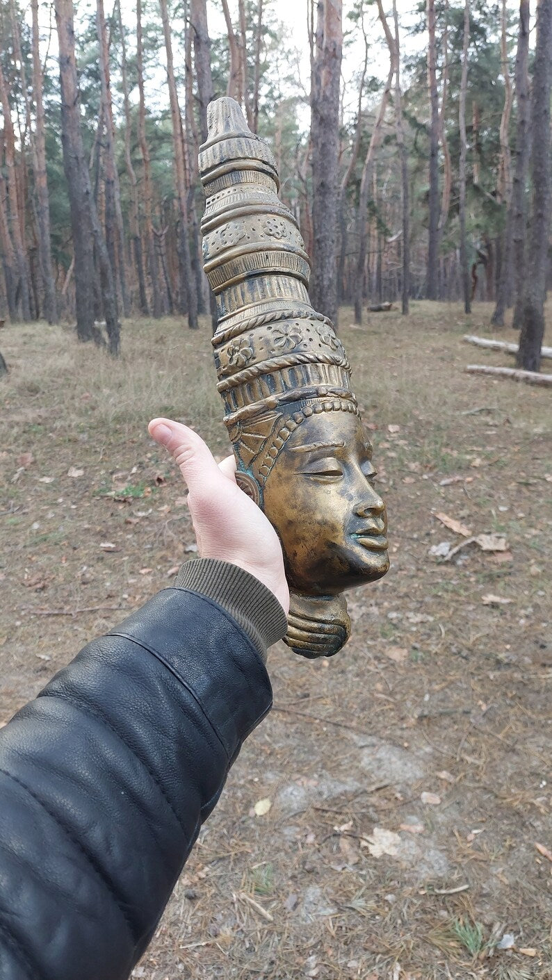 Buddha mask. Bronze buddha mask
