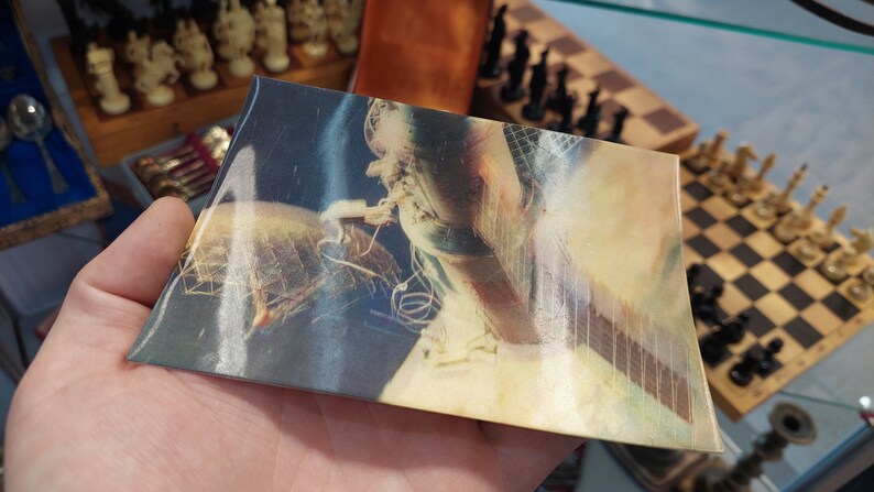 Postcard 3d. Astronauts in outer space. Orbital complex Salyut-Soyuz