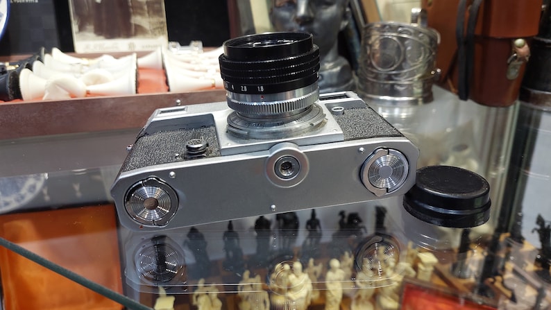 Vintage Camera Kiev with a Helios 103 1.8 / 53 lens in a leather case