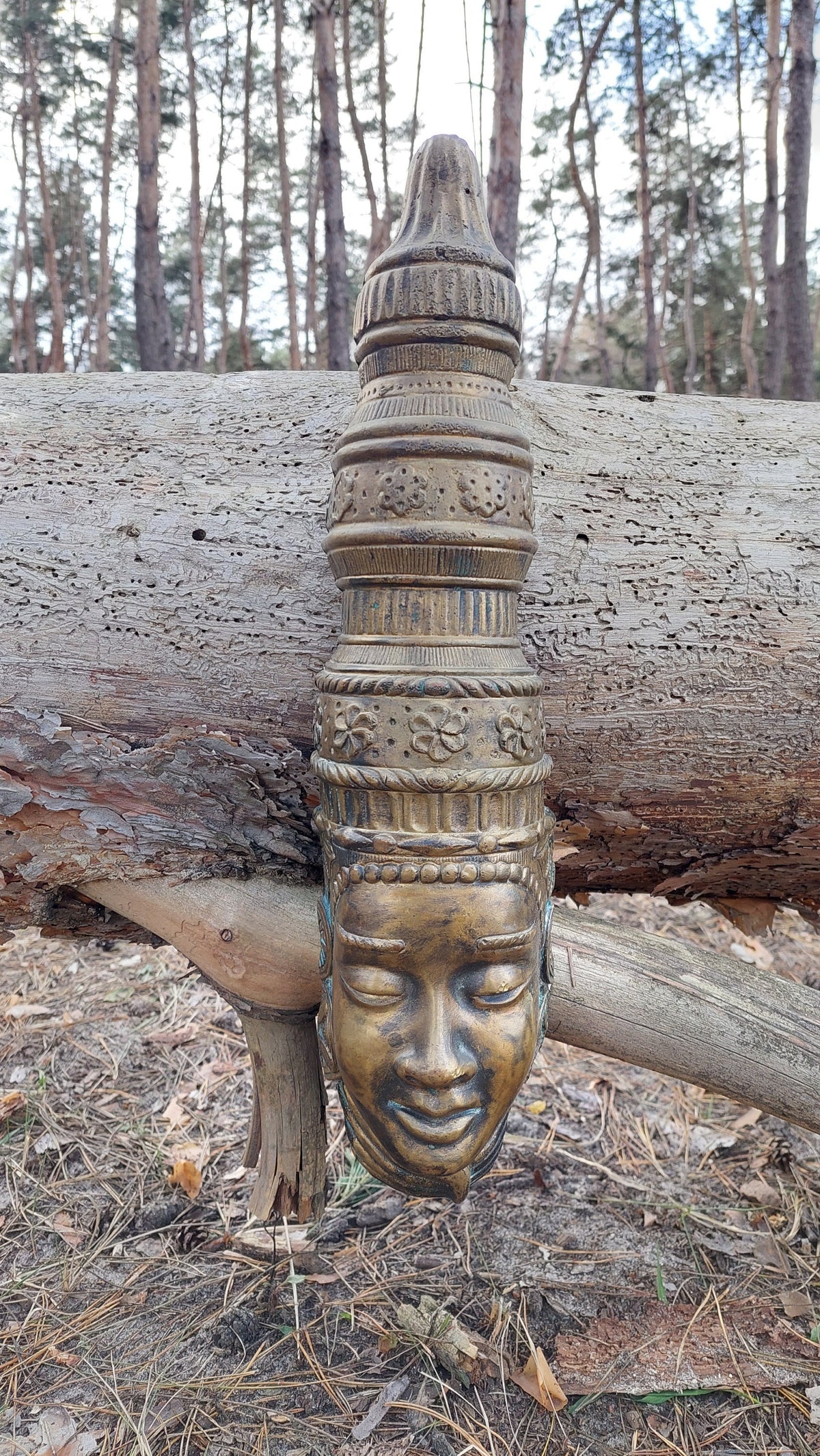 Buddha mask. Bronze buddha mask