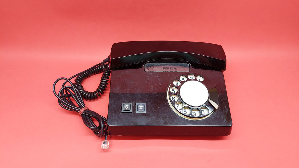 Antique telephone VEF TA_D with a rotary dial, a working Russian desk phone from the times of the USSR